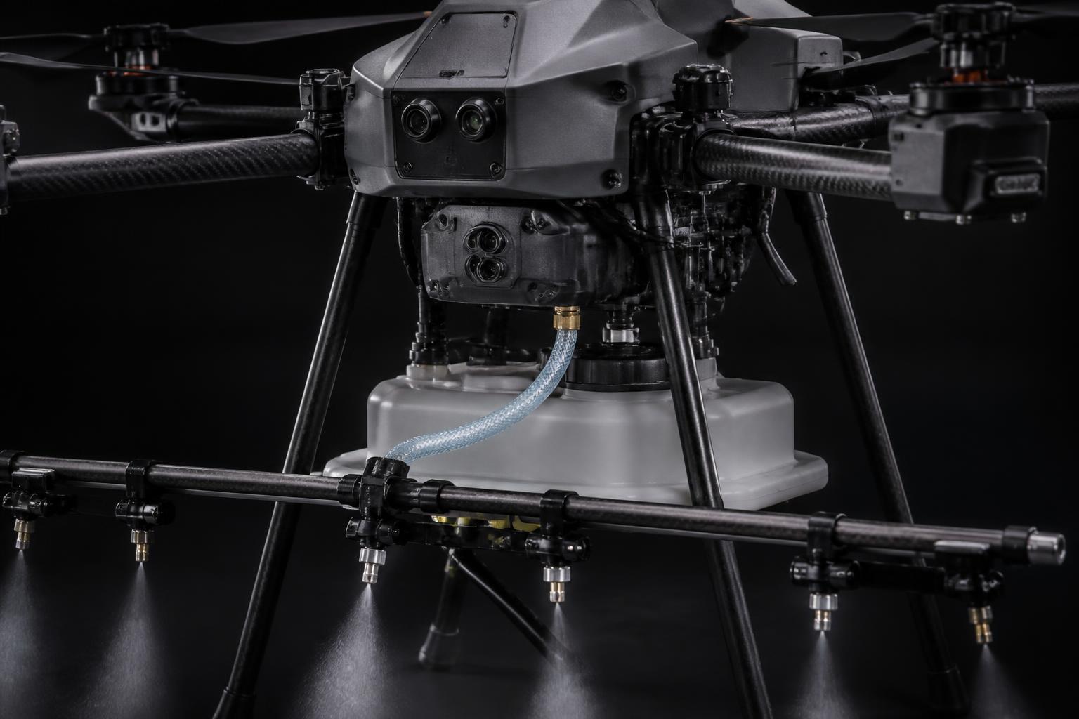 Professional cleaning drone with nozzle boom and water tank